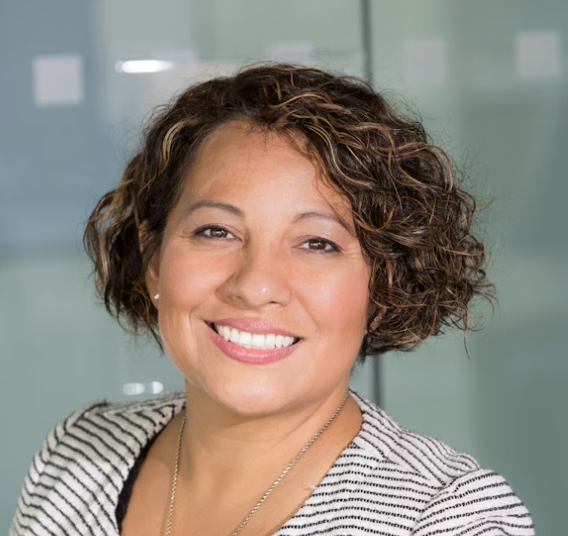 Woman smiling, office setting
